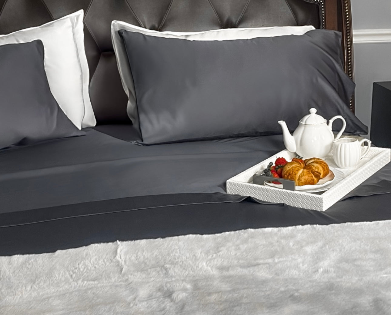  Close-up of Storm Gray bamboo viscose pillowcases and smooth fitted sheet — breathable and elegant bedding by Innocent Allure Enterprises.

